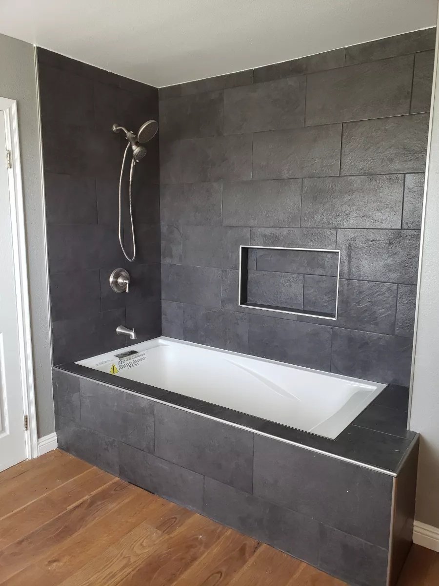 Drop-in tub with slate tile surround