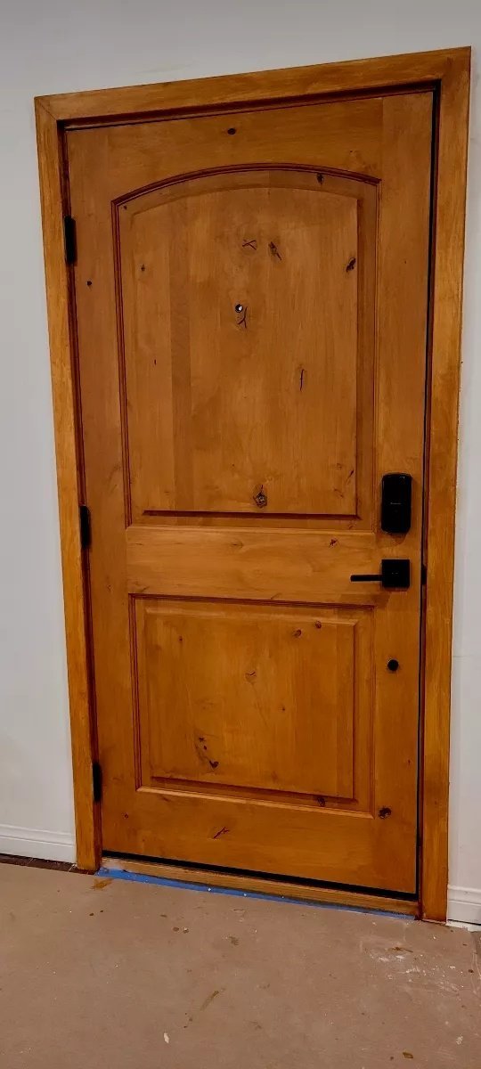 Knotty alder wood door with smart lock